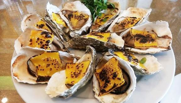 Hải sản nướng phô mai là món ăn đặc sắc tại Trung Gia Seafood